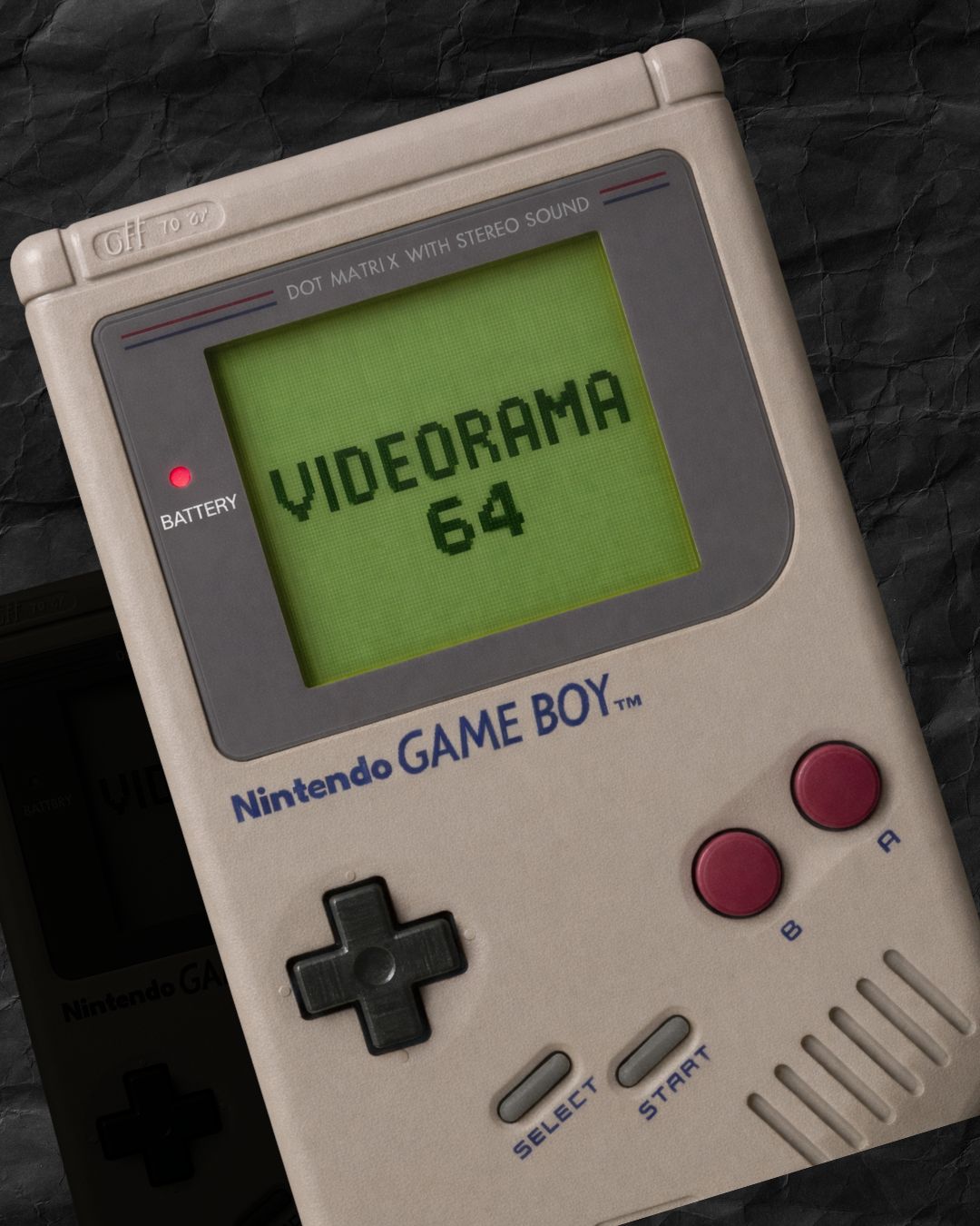 Videorama64 Nintendo-inspired soy candle collection — Game Boy screen displaying Videorama 64 in pixel font, dark textured background
